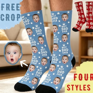 May include: Light blue socks with a repeating pattern of a baby's face, stars, and the text "BEST DAD EVER." Additional socks in red with "#1 DAD" text are also shown. The image also includes the text "FOUR STYLES."