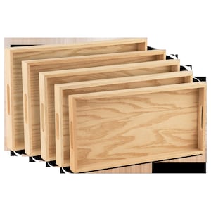 May include: Four wooden trays of varying sizes, stacked on top of each other. The trays are made of light brown wood with a natural grain pattern. The trays have a simple design with rounded edges and no handles.