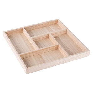May include: A wooden tray with five compartments, perfect for organizing small items. The tray is made of light-colored wood and has a smooth finish.