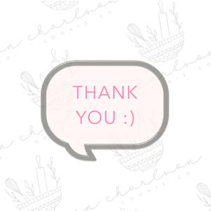 May include: A gray speech bubble cookie cutter with the words "THANK YOU :)" in pink. The background is white with a repeating pattern of baking tools and bowls.