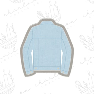 May include: A light blue denim jacket cookie cutter with a gray outline. The cutter has a classic design with button details and a collar. Perfect for creating themed cookies.
