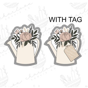 May include: Two white watering cans with a floral design and a tag that says "Happy Mother's Day".