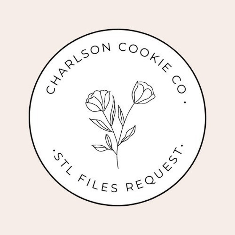 May include: Black and white logo with the text "Carlson Cookie Co." and "STL Files Request" around a circle with a stylized flower design in the center.