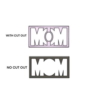 May include: Two versions of a "MOM" stencil, one with a cut-out design and one without. The stencil is black and white.
