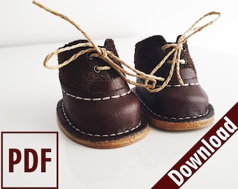 May include: A pair of brown leather boots with tan laces. The boots have a white stitching detail around the sole. The boots are tied together with the laces.
