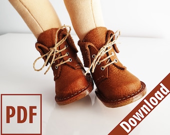 May include: Close-up of a pair of miniature brown leather boots with tan laces. The boots have a classic design with visible stitching and eyelets. The boots are on a white surface. The image also contains the text "PDF" and "Download".