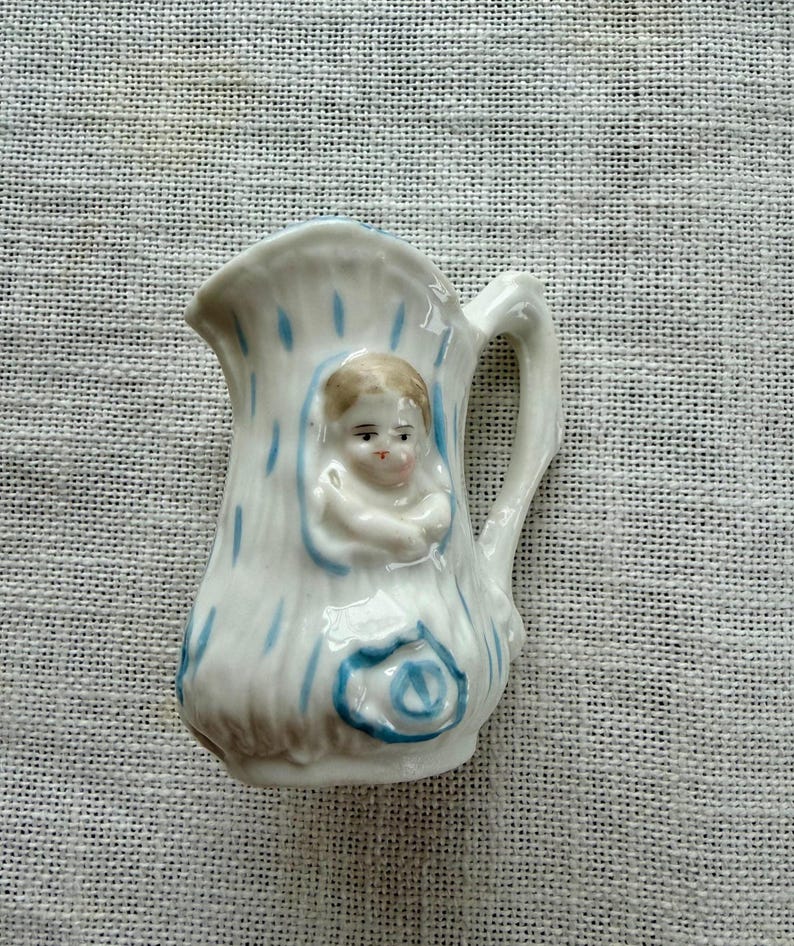 Antique Porcelain Pottery Childs Size Pitcher With Embossed Baby Faces ...