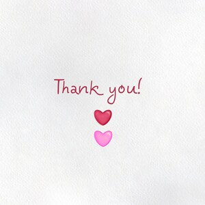 May include: A white card with the text "Thank you!" written in red cursive. There are two hearts below the text, one red and one pink.