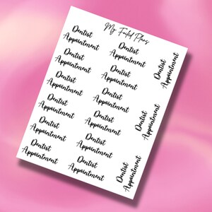May include: A sheet of white paper with black text that says "Dentist Appointment" repeated multiple times. The text is in a cursive font. The text "My Foiled Plans" is also written on the sheet of paper.