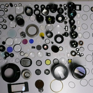 Incredible lot of lenses, objectives, photographic material, seals, prisms etc