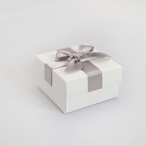 White wedding favour box with silver grey ribbon