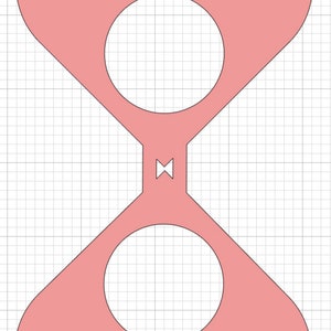 May include: A pink heart-shaped craft with two circular cutouts. The craft is made of paper or cardstock and is designed for a craft project.