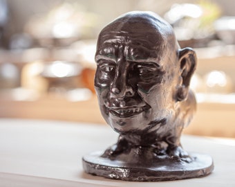 Sculpture "The A... with ears" made of graphite and concrete, suitable as a decorative gift or as a collector's item for the desk.