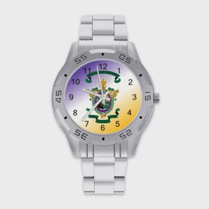 May include: A silver-toned analog wristwatch with a metal link band. The watch face features a gradient background transitioning from purple to yellow, displaying black numerals and a central crest with the text "VIR QUISQUE VIR".