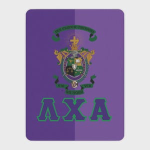May include: A rectangular purple mat featuring the Lambda Chi Alpha fraternity crest in the center with gold, green, and white details. Above the crest is a banner with the text PER CRUCEM CRESCENS and below is the text VIR QUISQUE VIR QUISQUE.