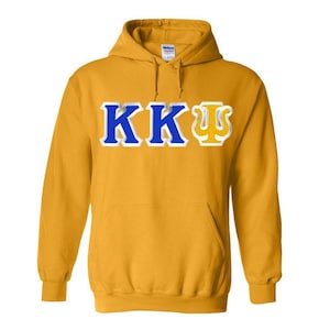 May include: A gold hooded sweatshirt with the letters "KKΨ" in blue and yellow on the front.