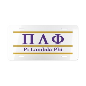May include: White license plate with the Greek letters ΠΛΦ in purple, above the words "Pi Lambda Phi" in a serif font. Two horizontal gold lines border the Greek letters and text. The plate has four mounting holes.