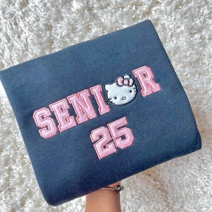 Custom Hi-Kitty Bow Senior 25 Inspired Glitter Crewneck Graduation Gift For Her Sweatshirt