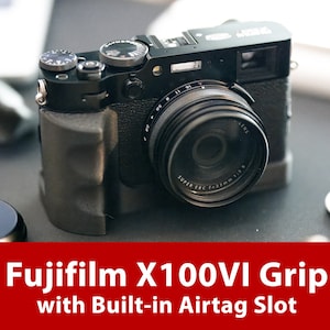May include: A black Fujifilm X100VI camera with a built-in AirTag slot. The camera has a black leather grip and a lens with a silver ring.