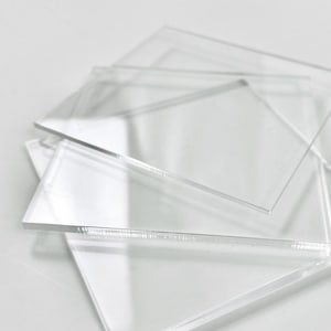 May include: Stack of clear acrylic sheets, perfect for crafting or DIY projects.