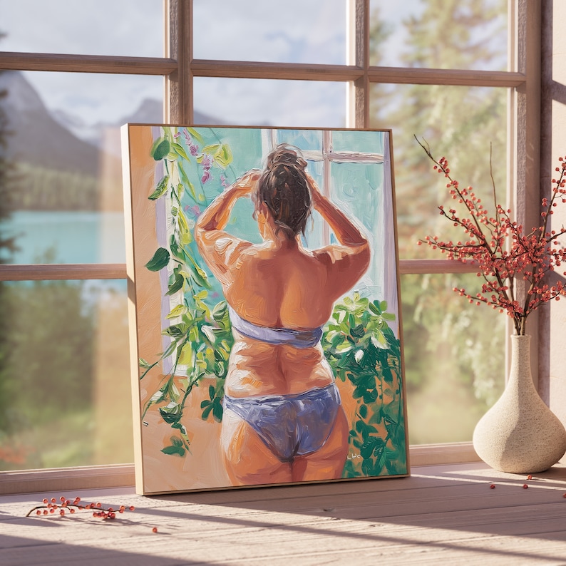May include: A painting of a person standing in front of a window, looking out at a view of a lake and mountains. The person is wearing a blue bikini top and a blue bikini bottom. The person has their back to the viewer and is adjusting their hair. The painting is framed in a wooden frame.