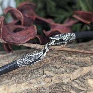 Braided leather cord necklace with snake silver bead caps