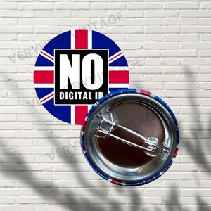 May include: A circular badge featuring the Union Jack flag design with the words "NO DIGITAL ID" in a black rectangle. The badge is predominantly blue, red, and white. The reverse side shows a safety pin.