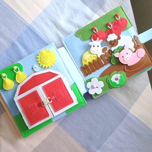 May include: A white ceramic mug with a black handle and the text "But First, Coffee" in a bold, black font. The mug is set against a blurred background, highlighting its simple design.