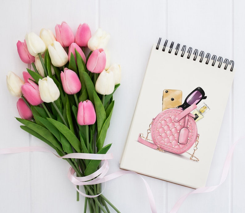 May include: A pink quilted handbag with a chain strap, a gold phone, sunglasses, and a bottle of perfume inside. The handbag is on a white background with a bouquet of pink and white tulips.