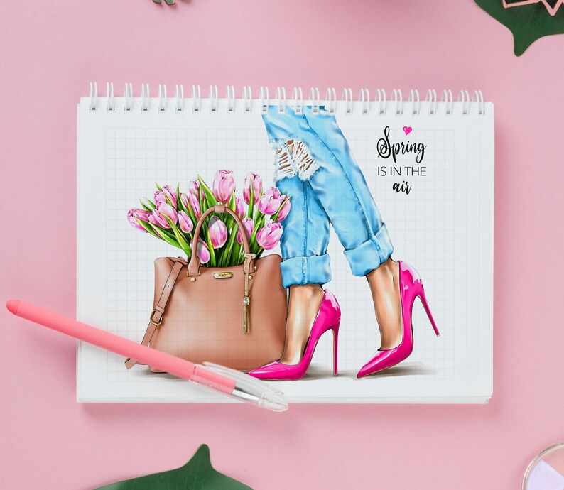 May include: A pink and white gridded notebook with a drawing of a woman wearing blue jeans and pink high heels. She is holding a brown handbag with a bouquet of pink tulips. The text "Spring is in the air" is written on the page.