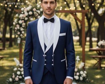May include: A navy blue suit with a white lapel and vest, paired with a black bow tie. The suit has a tailored fit and is worn with a white dress shirt. The image includes the text "ZF CLOTHING MEN'S WEAR".