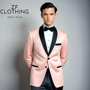 May include: A pink tuxedo jacket with a black satin lapel and a black bow tie. The jacket has a single button closure and a pocket on the left side. The text "ZF CLOTHING MEN'S WEAR" is visible in the top left corner of the image.