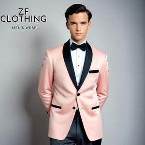 May include: A pink tuxedo jacket with a black satin lapel and a black bow tie. The jacket has a single button closure and a pocket on the left side. The text "ZF CLOTHING MEN'S WEAR" is visible in the top left corner of the image.