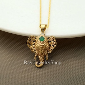 Gold Elephant Pendant Necklace: Tribal Brass Jewelry with Green Gem