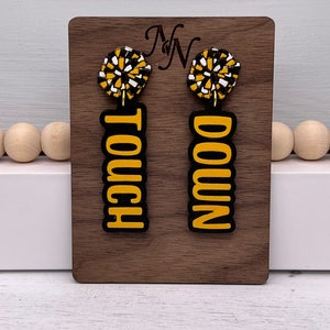 Touchdown, pom pom game day wooden stud earrings. Team spirit studs earrings. Hand cut and hand painted. Black, yellow and white.