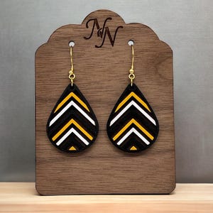 Black, yellow gold, white Game day wooden cutout chevron teardrop earrings. Team spirit. Large is double sided.  Hand painted. 3 sizes
