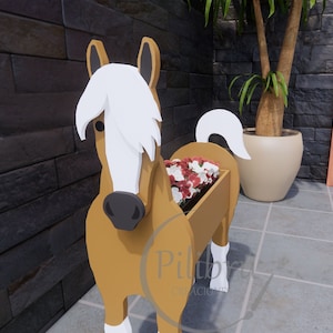 May include: A wooden horse planter with a white mane and tail. The planter is filled with pink flowers and is standing on a tiled floor.