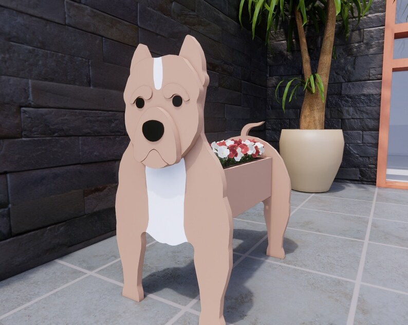 May include: A wooden planter shaped like a brown and white pit bull dog with red and white flowers in the planter.