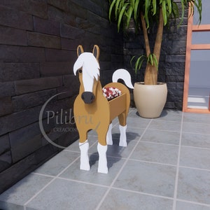 May include: A wooden horse planter with a brown body, white legs, and a white mane. The planter has a rectangular opening in the back for planting. The horse is standing on a tiled floor.