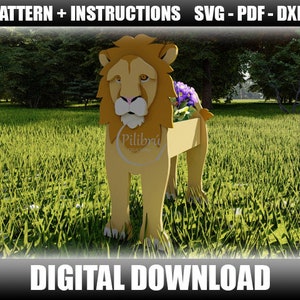 May include: A wooden lion planter with a flower pot in its mouth. The planter is standing on a green grassy field. The text "Pilibri" is visible on the planter.