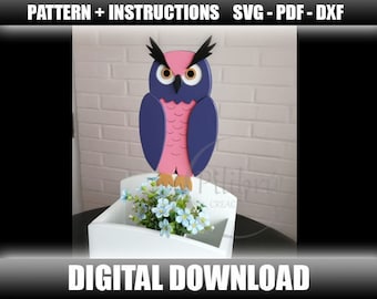 May include: A digital download pattern for a wooden owl planter. The owl is pink and purple with black eyes and a white background. The planter is white and has a small plant inside. The text "PATTERN + INSTRUCTIONS SVG - PDF - DXF" is at the top of the image and the text "DIGITAL DOWNLOAD" is at the bottom of the image.