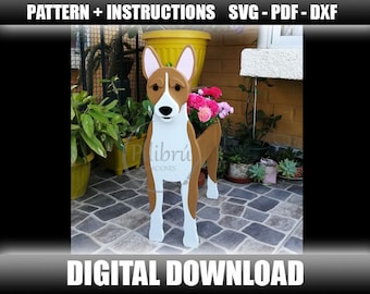 May include: A digital download pattern for a wooden planter shaped like a brown and white Basset Hound dog. The dog is standing on a stone patio with flowers in the planter.
