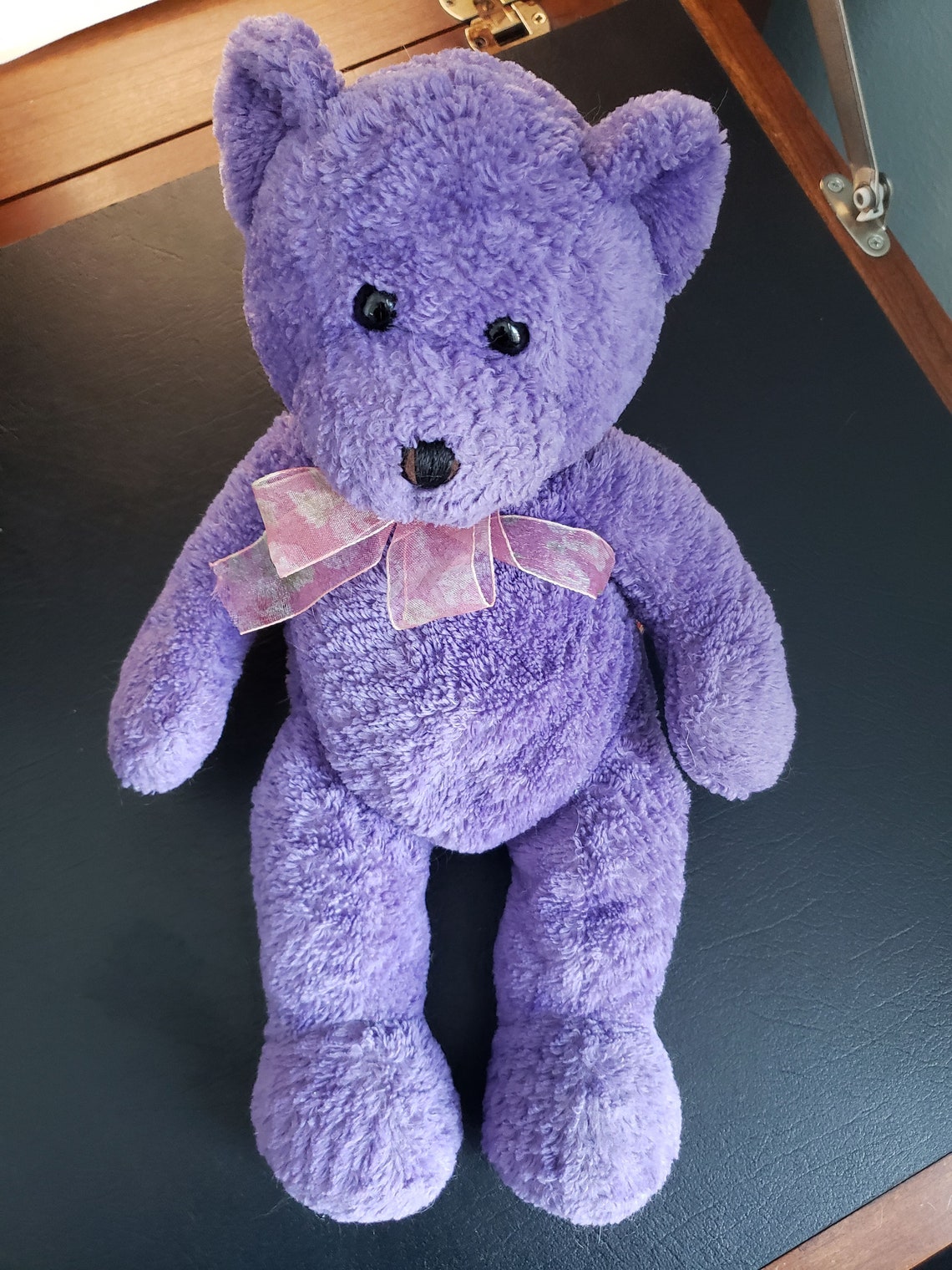 purple teddy bear made of roses