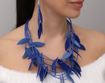 Handmade blue leather necklace and earring set with leaf motif, bohemian jewelry.