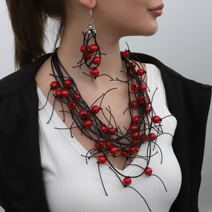 adjustable necklace with red beads on a black leather cord for women.Necklace L:32 inches