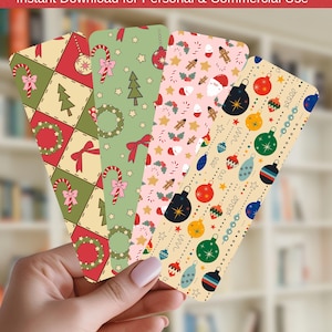 May include: Four rectangular bookmarks featuring retro Christmas patterns. The first has a red and green diamond grid with wreaths and candy canes. The second is sage green with trees and bows. The third is pink with gingerbread men. The fourth is cream with colourful ornaments.
