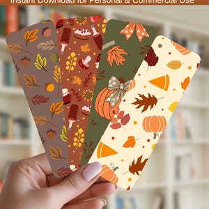 May include: Four rectangular bookmarks featuring Thanksgiving-themed patterns. The designs include autumn leaves, acorns, pumpkins with bows, pie slices, and festive food items in shades of orange, brown, green, and cream with a hole at the top.