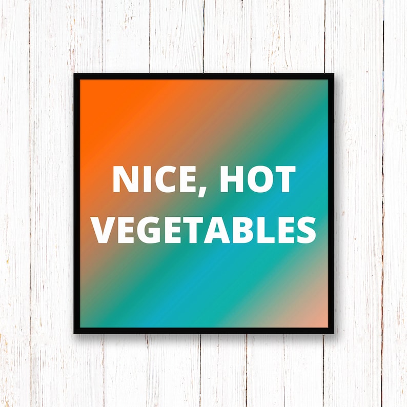 May include: A framed print with a gradient background of orange, blue, and green. The text "NICE, HOT VEGETABLES" is written in white on the print.