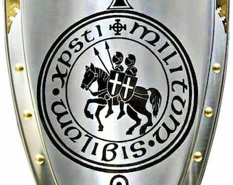 May include: A silver shield with a black and white design. The shield has a black cross at the top, a black circle with a knight on horseback and the text "X.P.S.T.I.M.I.L.I.T.U.M.B.I.S." around the outside, and a black Celtic knot at the bottom.