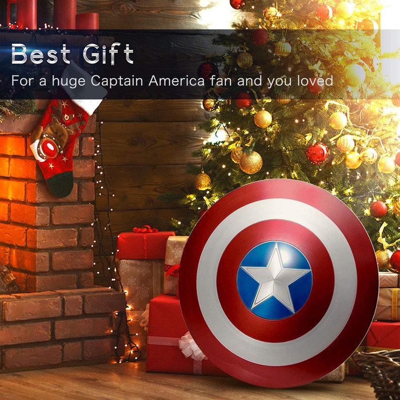 May include: A red, white, and blue Captain America shield with a star in the center. The shield is sitting in front of a Christmas tree with ornaments and a fireplace with a stocking.